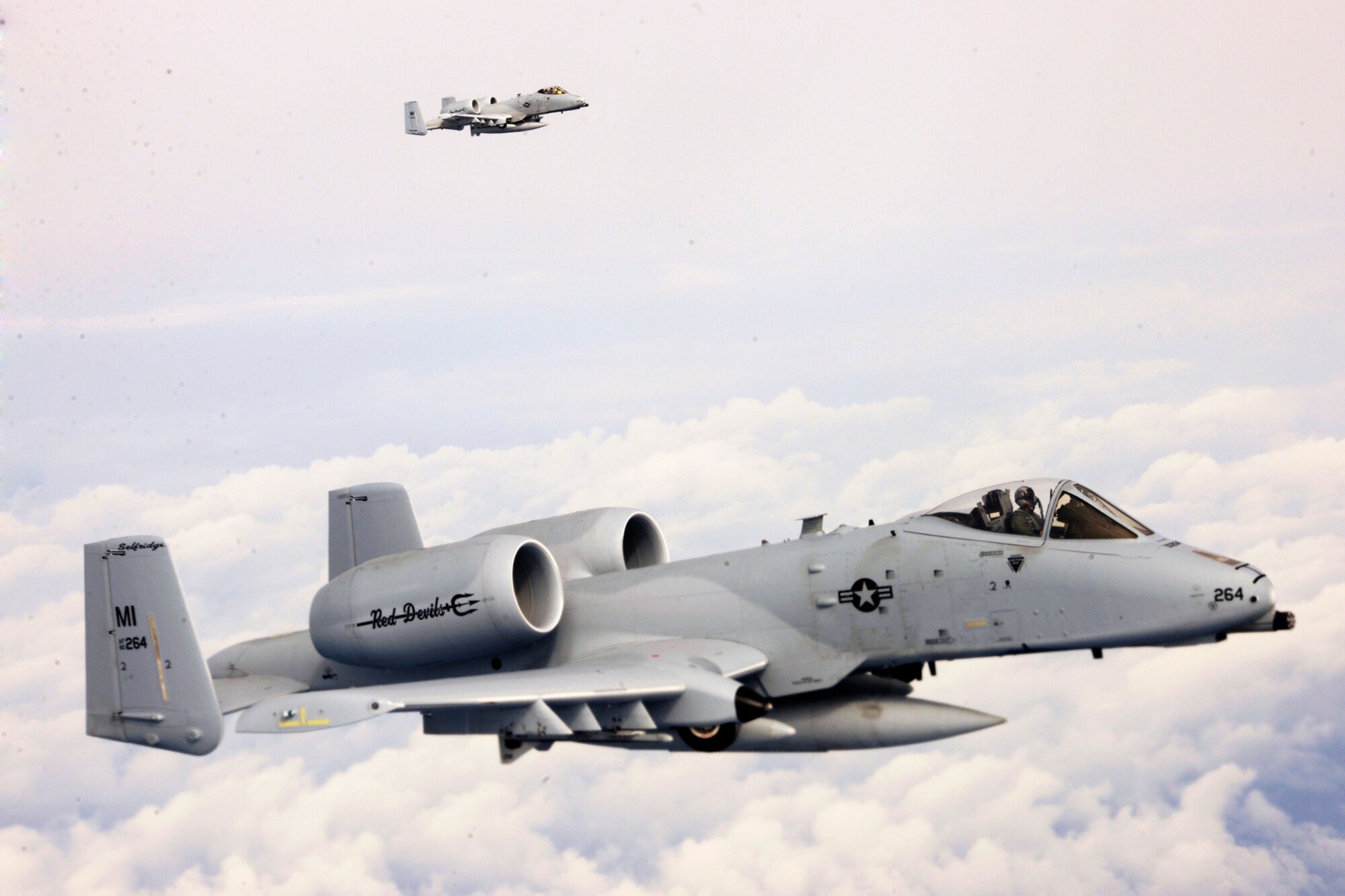 150411-Z-EZ686-983 -- Two A-10 Thunderbolt II’s of the 107th Fighter Squadron from Selfridge Air National Guard Base Mich., fly toward Southwest Asia in a deployment of some 350 Michigan Air National Guard Airmen from the base. The Michigan Airmen will be supporting U.S. Central Command operations in the region. (U.S. Air National Guard photo by MSgt. David Kujawa/Released)