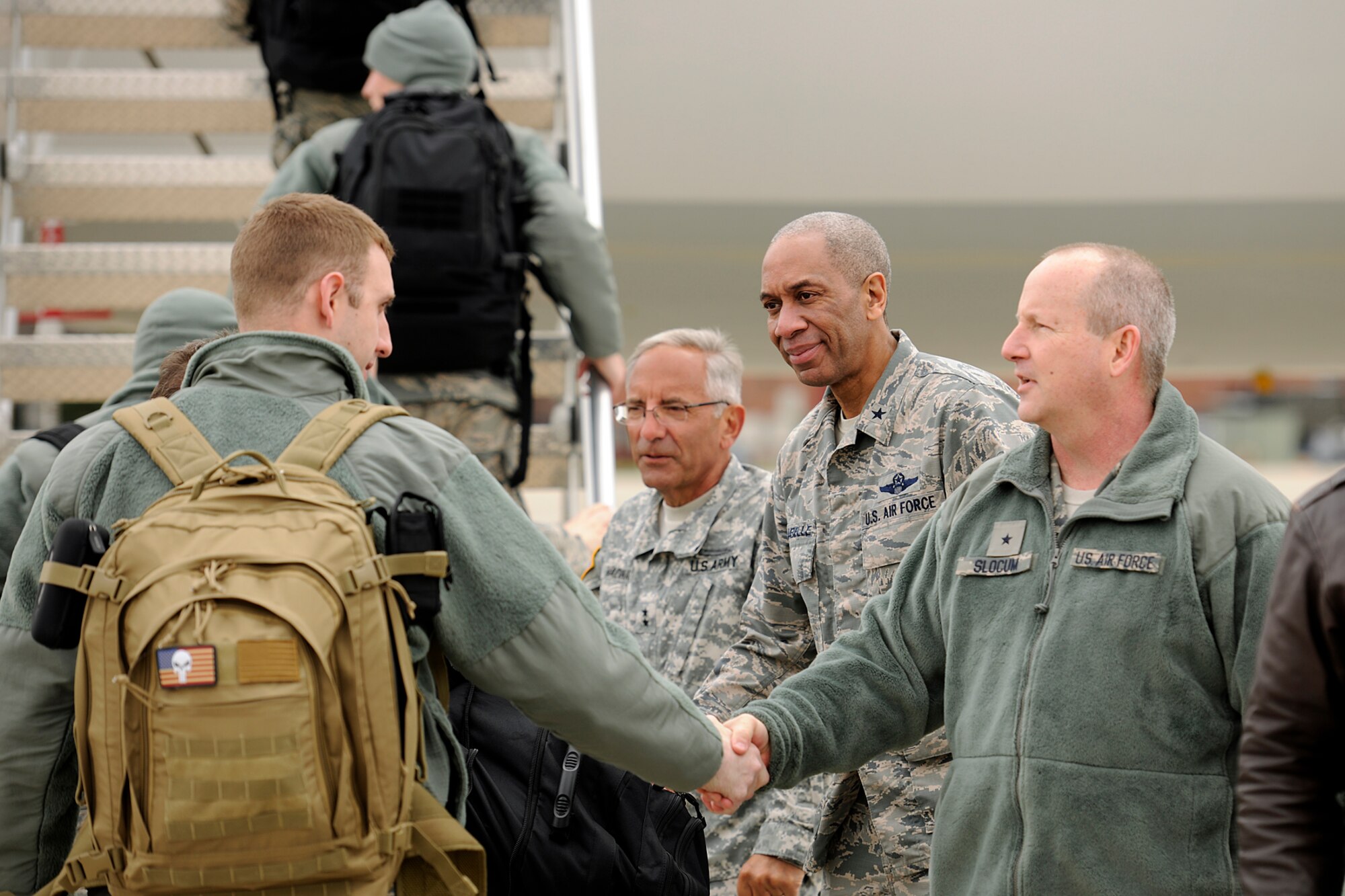 150410-Z-EZ686-027 -- Senior leaders of the Michigan National Guard shake hands with deploying members of the 127th Wing at Selfridge Air National Guard Base, Mich., April 10, 2015. Sending off the Airmen are Major Gen. Gregory J. Vadnais, adjutant general of Michigan; Brig. Gen. Leonard W. Isabelle Jr., commander of the Michigan Air National Guard; and Brig. Gen. John D. Slocum, commander of the 127th Wing. (U.S. Air National Guard photo by Master Sgt. David Kujawa)