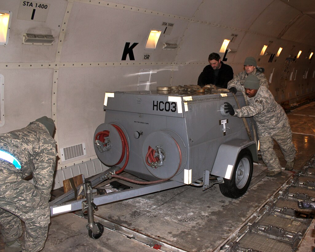 150408-Z-VA676-007 -- Airmen from the 127th Logistics Readiness Squadron and supporting units, prepare and load cargo to support a major deployment of personnel and aircraft from the 127th Wing at Selfridge Air National Guard Base, Mich. The deployment to the U.S. Central Command Area of Responsibility took place in early April 2015. Because of the flight schedules, much of the loading had to take place in the middle of the night. (U.S. Air National Guard photo by Tech. Sgt. Dan Heaton)
