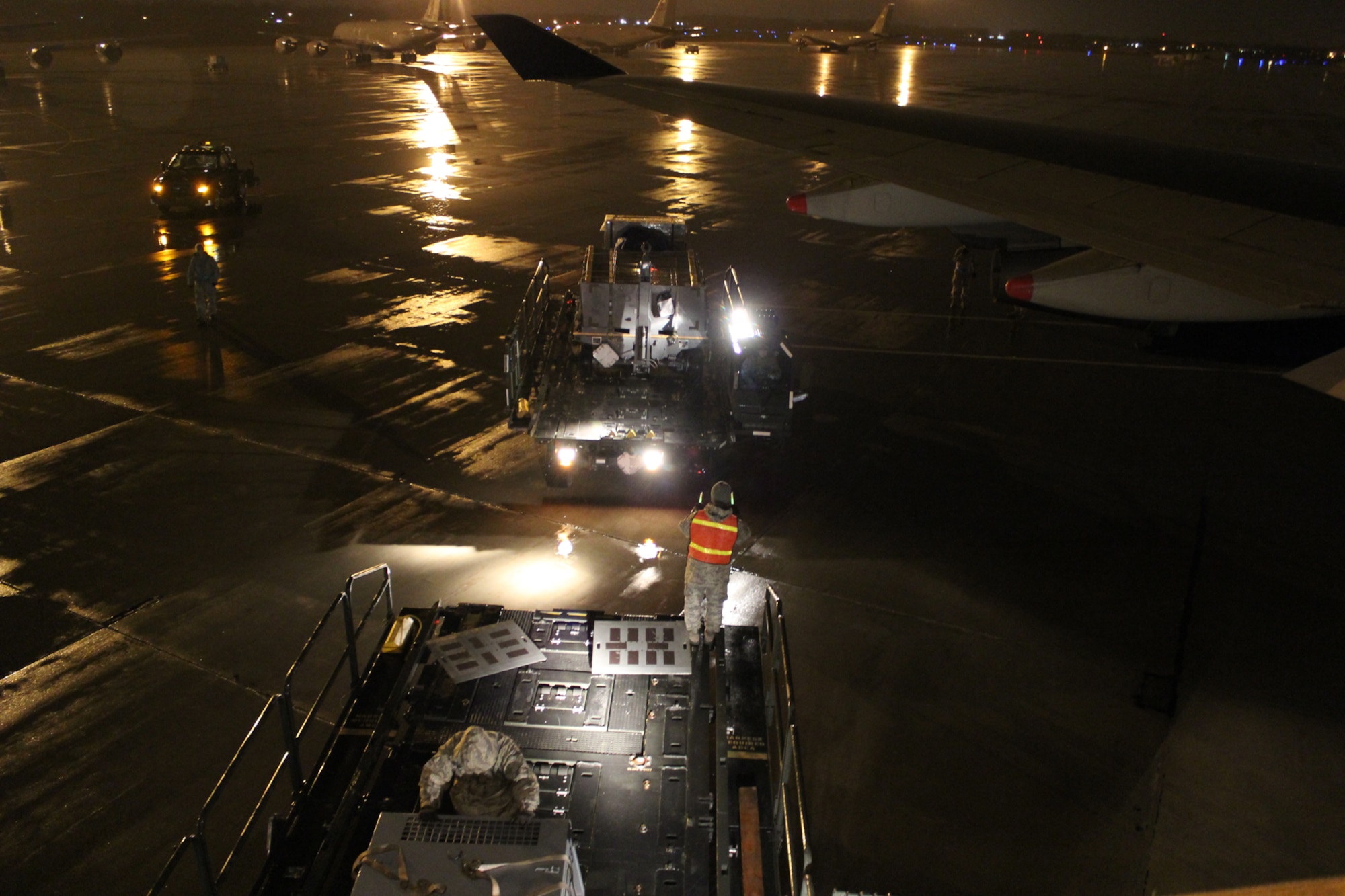 150408-Z-VA676-030 -- Airmen from the 127th Logistics Readiness Squadron and supporting units, prepare and load cargo to support a major deployment of personnel and aircraft from the 127th Wing at Selfridge Air National Guard Base, Mich. The deployment to the U.S. Central Command Area of Responsibility took place in early April 2015. Because of the flight schedules, much of the loading had to take place in the middle of the night. (U.S. Air National Guard photo by Tech. Sgt. Dan Heaton)