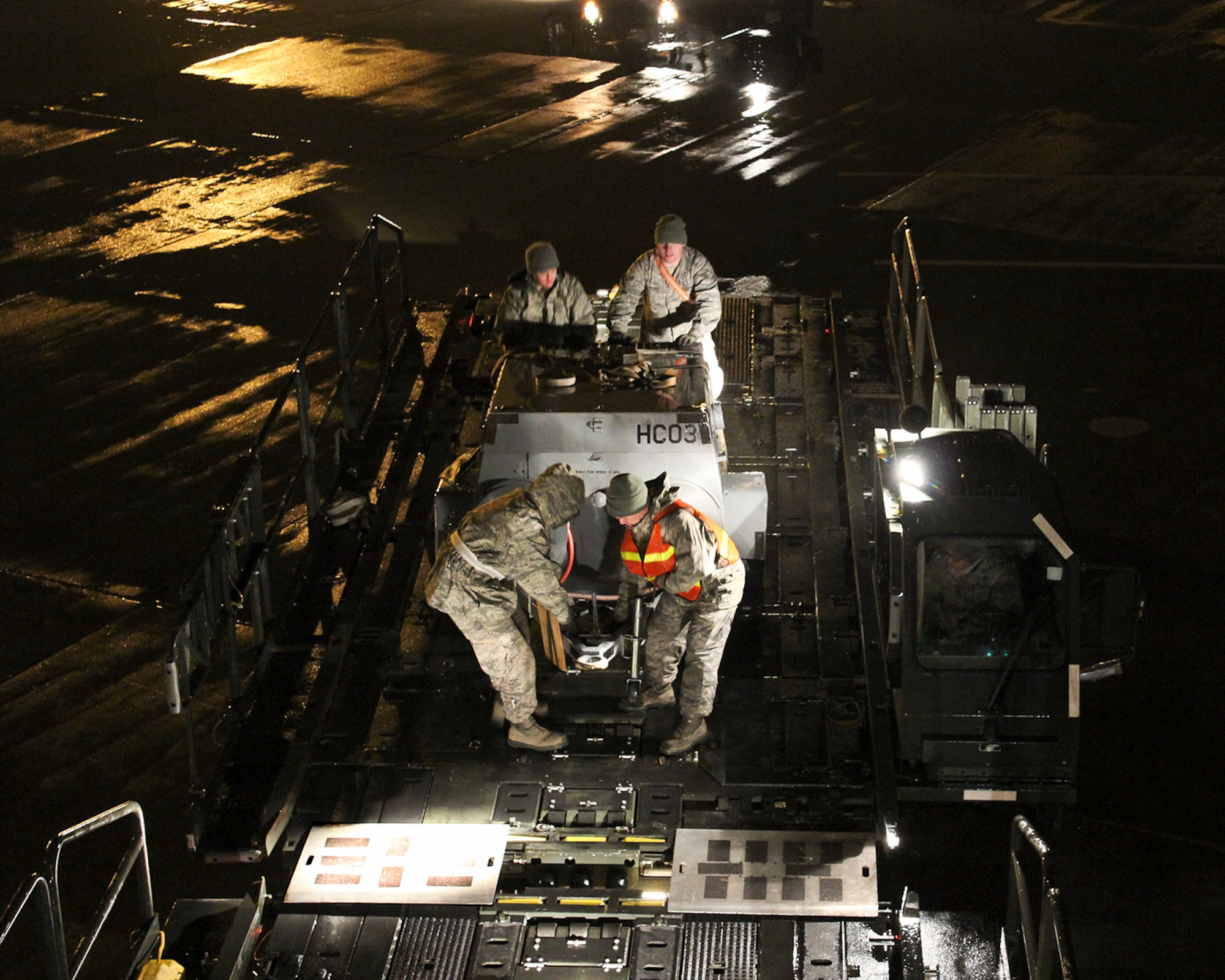 150408-Z-VA676-025 -- Airmen from the 127th Logistics Readiness Squadron and supporting units, prepare and load cargo to support a major deployment of personnel and aircraft from the 127th Wing at Selfridge Air National Guard Base, Mich. The deployment to the U.S. Central Command Area of Responsibility took place in early April 2015. Because of the flight schedules, much of the loading had to take place in the middle of the night. (U.S. Air National Guard photo by Tech. Sgt. Dan Heaton)