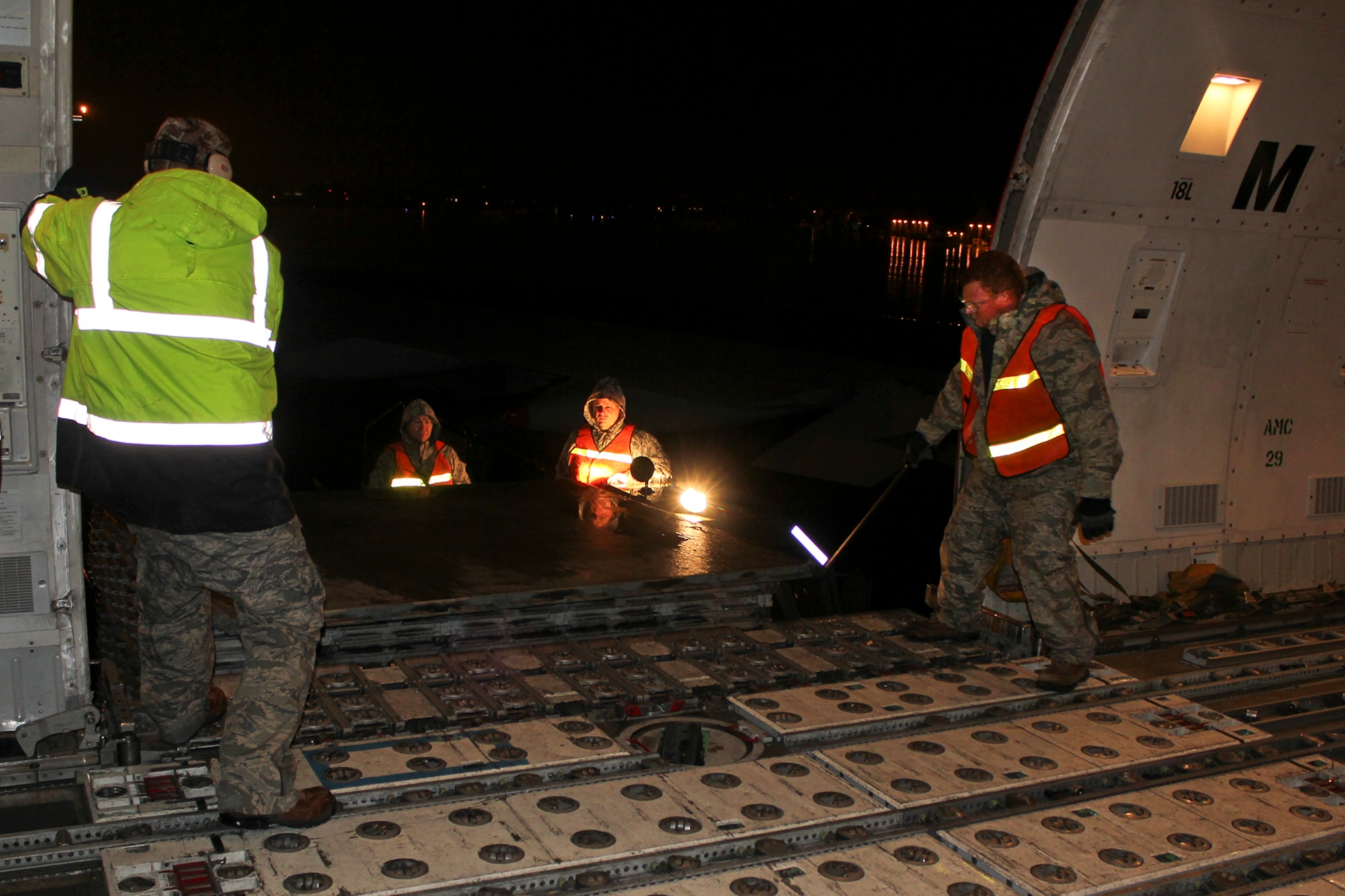 150408-Z-VA676-020 -- Airmen from the 127th Logistics Readiness Squadron and supporting units, prepare and load cargo to support a major deployment of personnel and aircraft from the 127th Wing at Selfridge Air National Guard Base, Mich. The deployment to the U.S. Central Command Area of Responsibility took place in early April 2015. Because of the flight schedules, much of the loading had to take place in the middle of the night. (U.S. Air National Guard photo by Tech. Sgt. Dan Heaton)