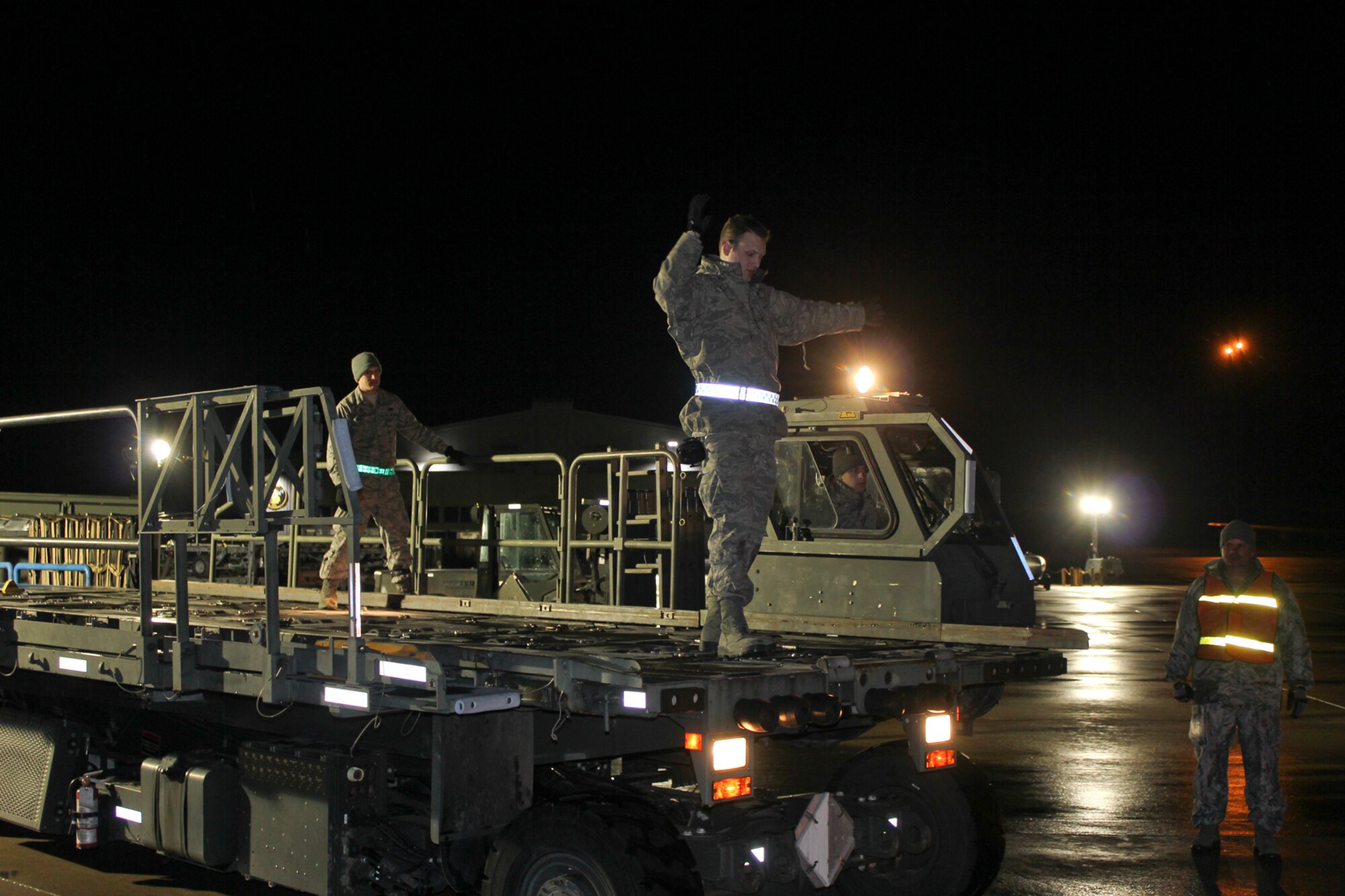 150408-Z-VA676-002 -- Airmen from the 127th Logistics Readiness Squadron and supporting units, prepare and load cargo to support a major deployment of personnel and aircraft from the 127th Wing at Selfridge Air National Guard Base, Mich. The deployment to the U.S. Central Command Area of Responsibility took place in early April 2015. Because of the flight schedules, much of the loading had to take place in the middle of the night. (U.S. Air National Guard photo by Tech. Sgt. Dan Heaton)