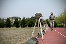 1st Lt. Earon Brown, 8th Fighter Wing public affairs deputy chief and alternate Sexual Assault Response Coordinator, reflects on past sexual assault cases as he participates in Kunsan’s silent walk in observance of Sexual Assault Awareness and Prevention Month April 24, 2015, at Kunsan Air Base, Republic of Korea. The silent walk displayed over 100 helmets, symbolizing examples of both reported and unreported sexual assaults at Kunsan since 2005. (U.S. Air Force photo by Senior Airman Katrina Heikkinen/Released)