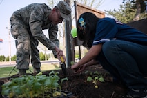 8th Fighter Wing Airmen plant various fruits and vegetables in the Wolf Pack Garden in observance of Earth Day at Kunsan Air Base, Republic of Korea, April 22, 2015. The garden project started March 14 as part of a community initiative to promote healthy living for Wolf Pack Airmen. (U.S. Air Force photo by Tech. Sgt. George Maddon/Released)