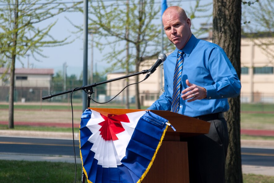 Bill Goins, 8th Medical Operations Squadron health promotion program coordinator, speaks during the grand opening of the Wolf Pack Garden in observance of Earth Day at Kunsan Air Base, Republic of Korea, April 22, 2015. The garden project started March 14 as part of a community initiative to promote healthy living for Wolf Pack Airmen. 