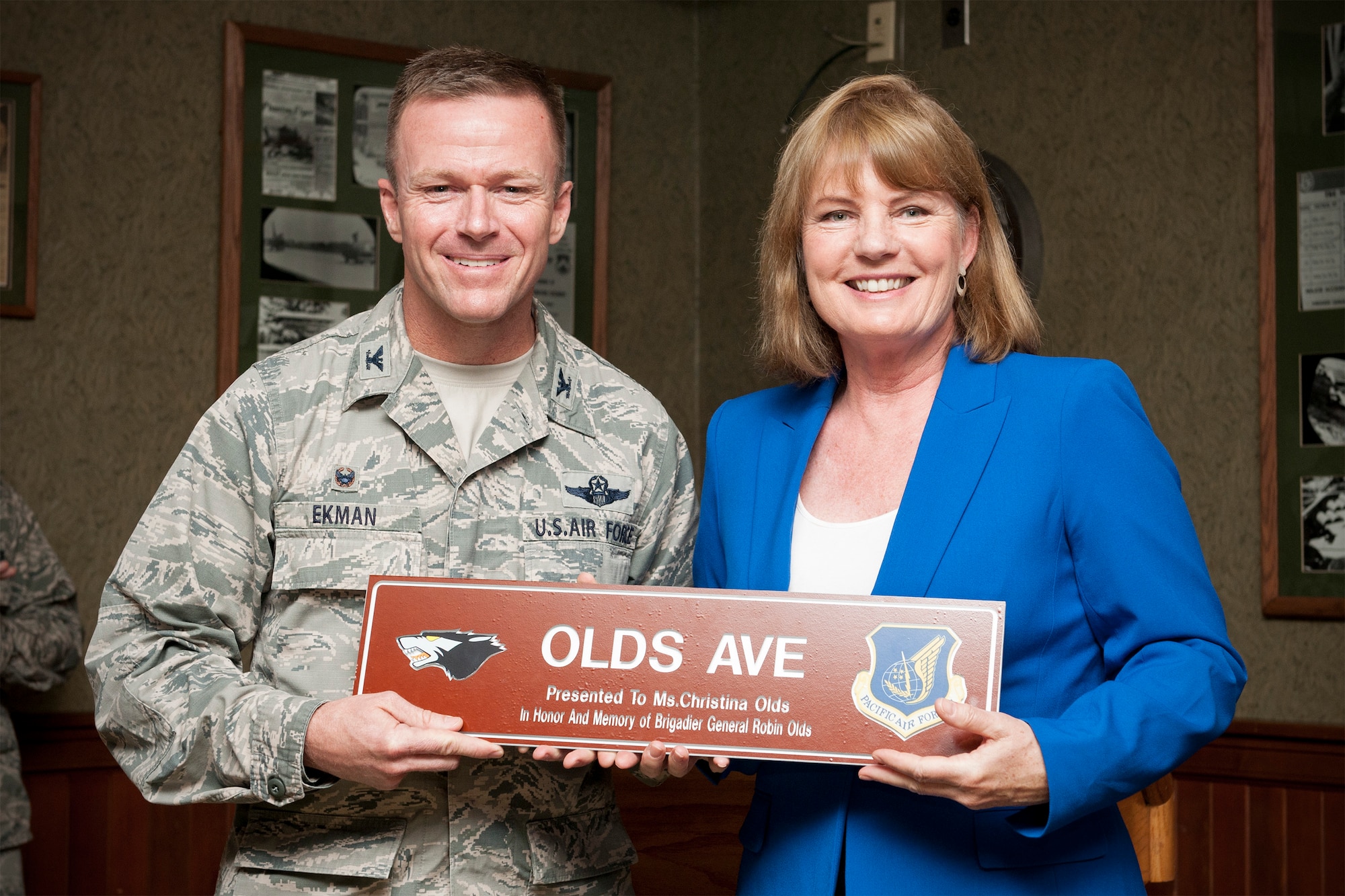 Col. Ken “Wolf” Ekman, 8th Fighter Wing commander, poses with Christina Olds, daughter of Brig. Gen. Robin Olds, Wolf One, during a memorialization ceremony April 23, 2015, at Kunsan Air Base, Republic of Korea.  Olds was not only rated a “triple ace,” a title he earned after shooting down 17 enemy aircraft during World War II and the Vietnam War, but he was also credited with 107 combat missions and 24.5 victories. (U.S. Air Force photo by Senior Airman Katrina Heikkinen/Released)