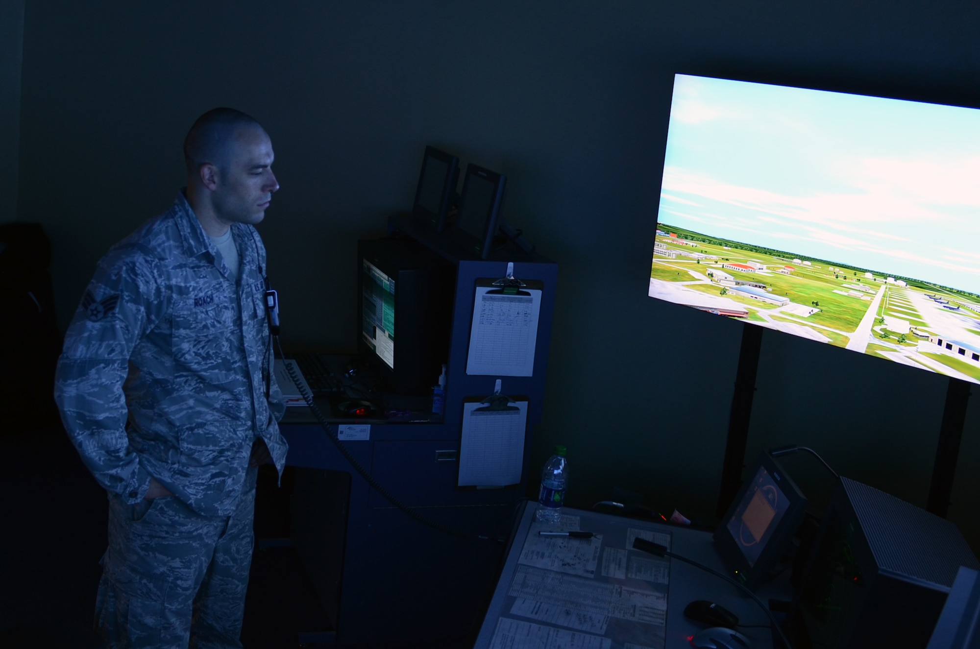 Senior Airman Shaun Roach, 36th Operations Support Squadron air traffic control specialist, trains on the tower simulation system on Andersen Air Force Base, Guam, April 23, 2015. Andersen air traffic controllers work with deployed aircraft and occasionally foreign aircraft to support Andersen’s mission on a daily basis. (U.S. Air Force photo by Airman 1st Class Alexa Ann Henderson/Released)