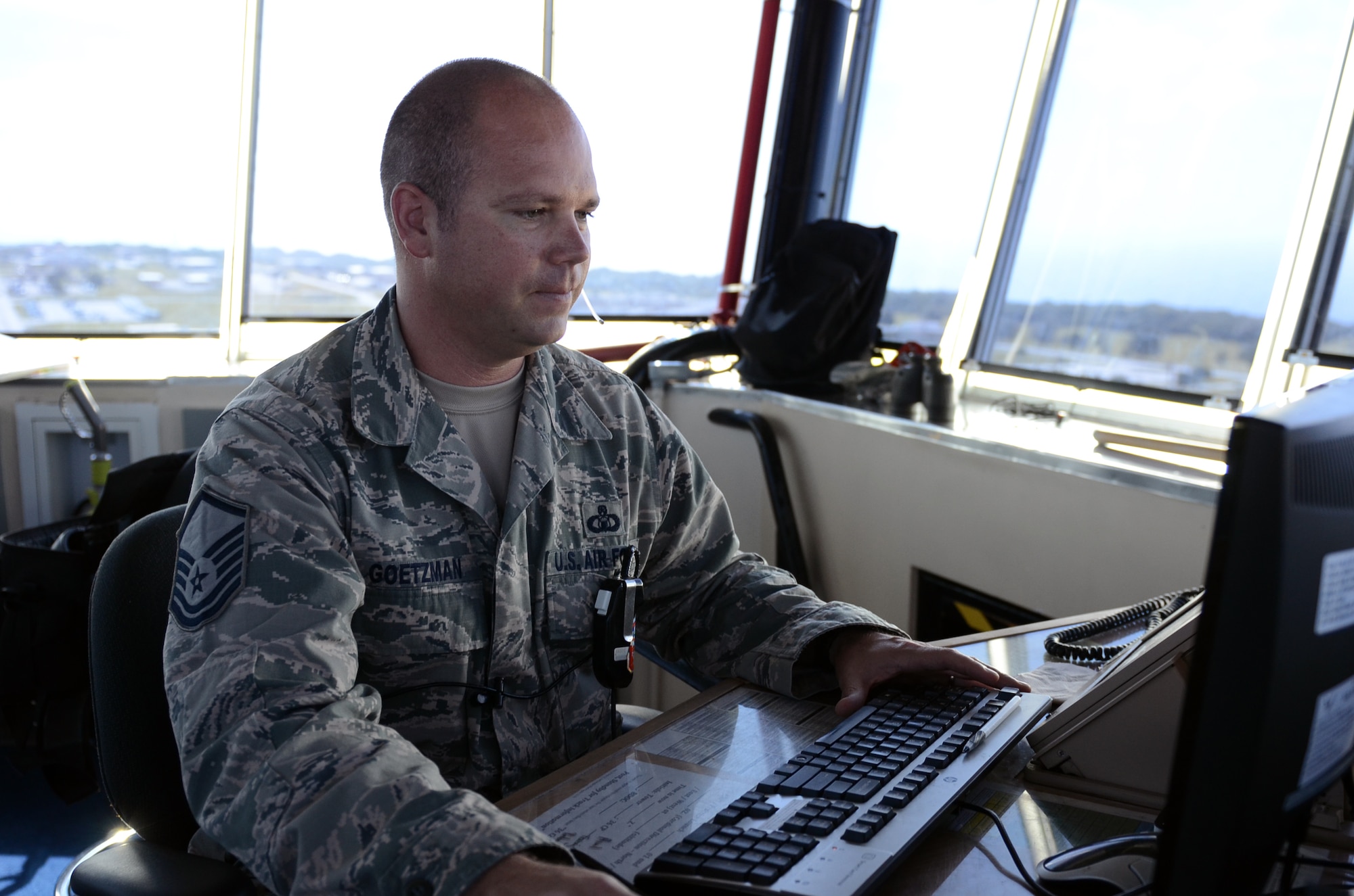 Master Sgt. Shelby Goetzman, 36th Operations Support Squadron chief controller, logs in mission information on Andersen Air Force Base, Guam, April 23, 2015. Andersen air traffic controllers work with deployed aircraft and occasionally foreign aircraft to support Andersen’s mission on a daily basis. (U.S. Air Force photo by Airman 1st Class Alexa Ann Henderson/Released)