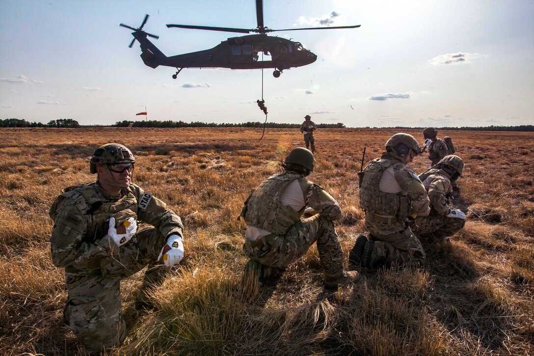 Airmen perform fast-rope insertion and extraction system training from a UH-60 Black Hawk helicopter on Joint Base McGuire-Dix-Lakehurst, N.J., April 21, 2015. The airmen are assigned to the New Jersey Air National Guard's 227th Air Support Operations Squadron and the helicopter crew is assigned to the New Jersey National Guard's 1st Battalion, 150th Assault Helicopter Battalion. The airmen were recertified on FRIES training by soldiers assigned to the Maryland Army National Guard's Long Range Surveillance Company C, 1st Battalion, 158th Cavalry. FRIES is used when a fast exit from a rotary-wing aircraft into a restricted area, including water operations, is required.  It provides a method for inserting and extracting special operations forces when an aircraft cannot land.
