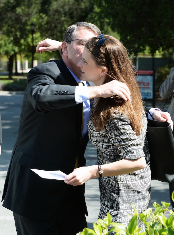 Defense Secretary Ash Carter greets his daughter, Ava, before delivering a lecture at Stanford University in Stanford, Calif., April 23, 2015. 