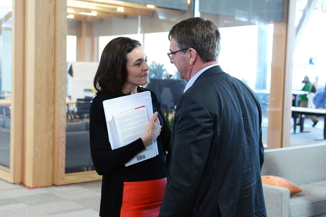 Defense Secretary Ash Carter talks with Sheryl Sandberg, Facebook Inc.'s chief operating officer, at Facebook's headquarters in Menlo Park, Calif., April 23, 2015.  
