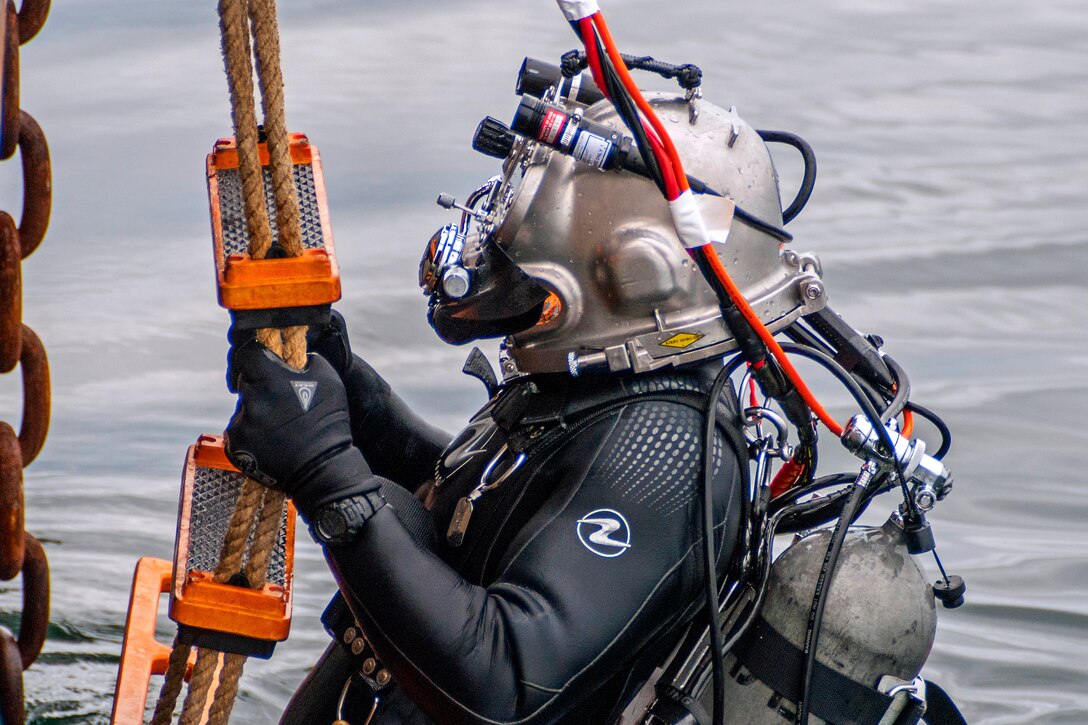 A Coast Guard diver exits the water after completing a successful training dive from the Coast Guard cutter George Cobb in the waters off San Pedro, Calif., April 22, 2015.
