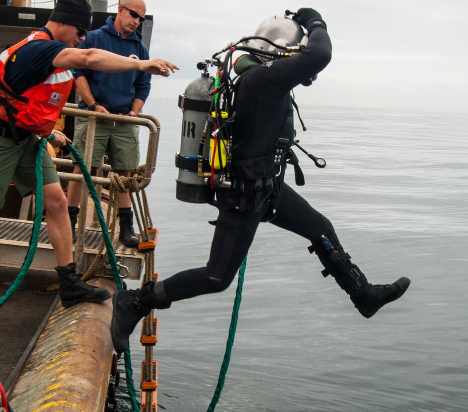 A Coast Guard diver assigned to Coast Guard Dive Locker West enters the waters off the coast of San Pedro, Calif., from the Coast Guard cutter George Cobb, April 22, 2015. On April 1, the Coast Guard established its 22nd rating, officially recognizing diving as a primary career path. The training was one of the first decompression dives made by rated Coast Guard divers.