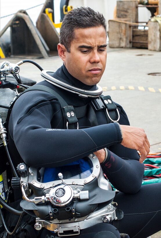 Coast Guard Petty Officer 1st Class Manuel Severino, assigned to Coast Guard Dive Locker West, prepares for a training dive from the Coast Guard cutter George Cobb in the waters off the coast of San Pedro, Calif., April 22, 2015.