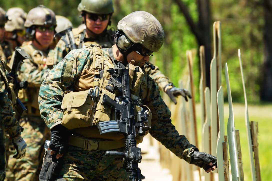 Chilean special operations soldiers review their shot groups during a ...