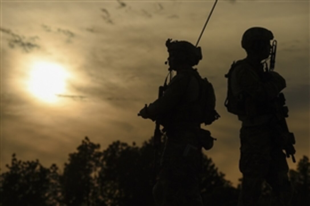 Airmen prepare a range for an AC-130 gunship live-fire mission during Emerald Warrior 2015 on Camp Shelby, Miss., April 22, 2015. The airmen are combat controllers assigned to the 21st Special Tactics Squadron.