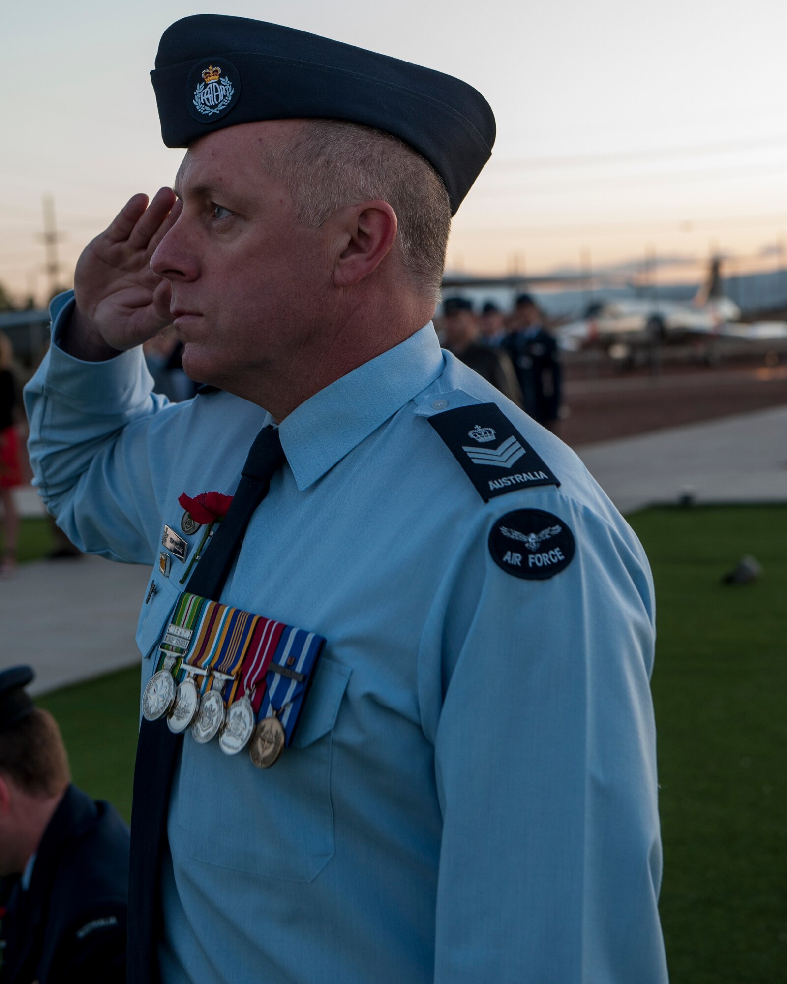 A member of the Royal Australian Air Force salutes during the playing of Reveille at the Anzac Day commemorative service, April 25, 2015 at Holloman Air Force Base, N.M. The word Anzac, short for Australian and New Zealand Army Corps, means any Australian or New Zealander who fought or served in World War I. During World War II, Anzac Day became the day for Australians and New Zealanders to remember the lives of those lost in the war, and recognize the qualities of courage, mateship and sacrifice. (U.S. Air Force photo by Airman 1st Class Emily A. Kenney/Released)