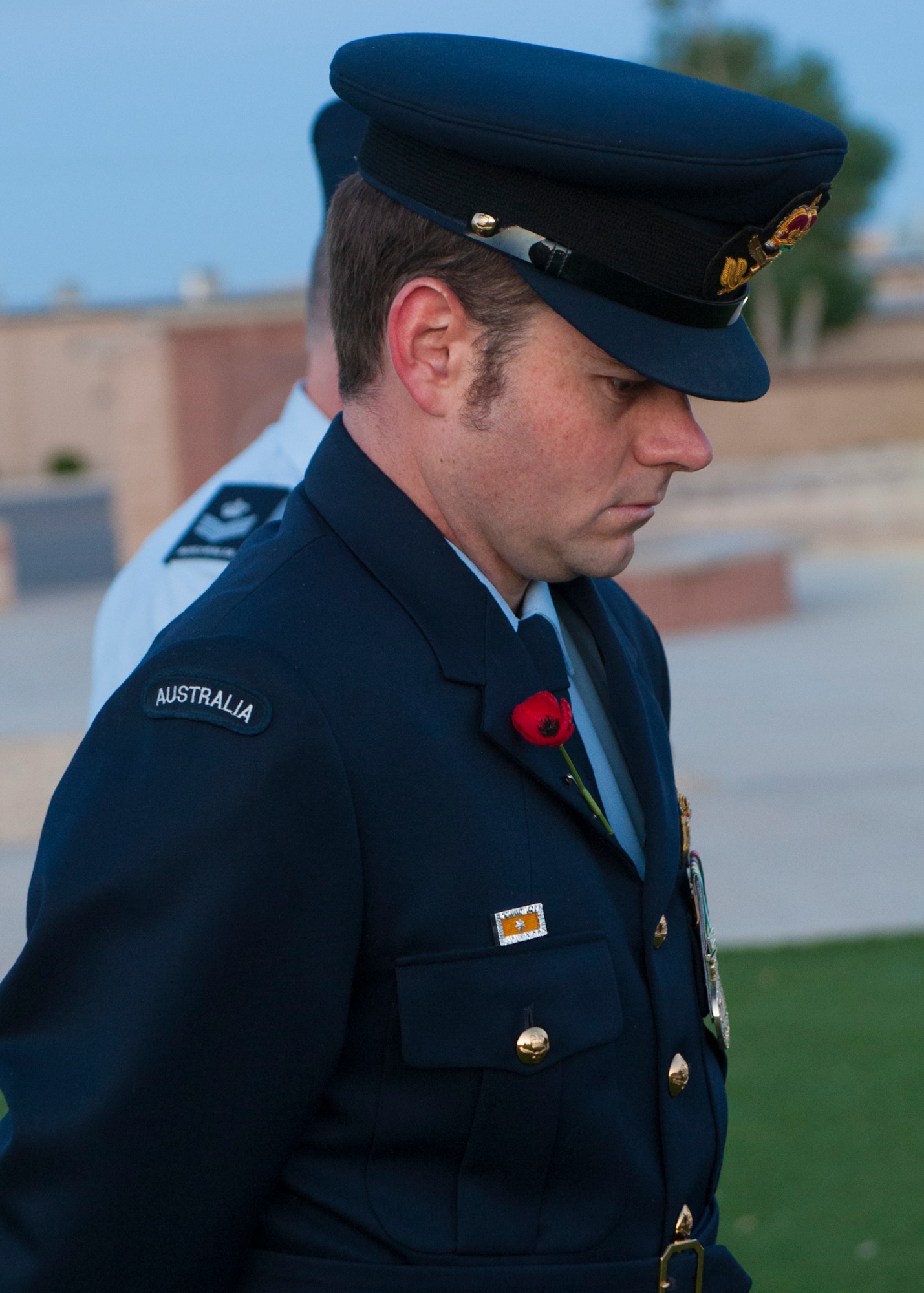 A member of the Royal Australian Air Force bows his head during a minute of silence at the Anzac commemorative service April 25, 2015 at Holloman Air Force Base, N.M. The word Anzac, short for Australian and New Zealand Army Corps, means any Australian or New Zealander who fought or served in World War I. During World War II, Anzac Day became the day for Australians and New Zealanders to remember the lives of those lost in the war, and recognize the qualities of courage, mateship and sacrifice. (U.S. Air Force photo by Airman 1st Class Emily A. Kenney/Released)