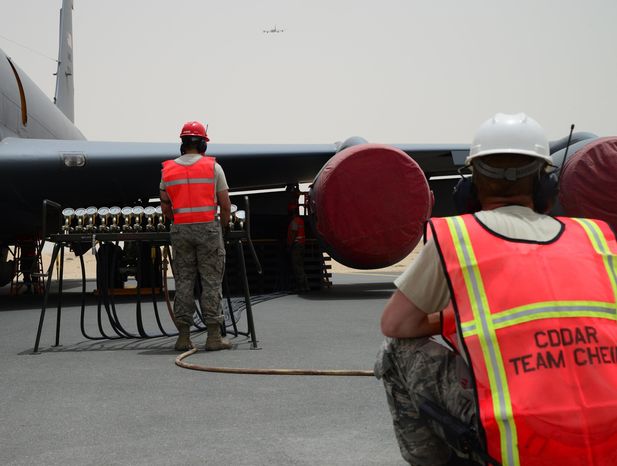Airmen from the 379th Expeditionary Maintenance Group Crashed, Damaged, Disabled Aircraft Recovery Team inflate airbags under the wing of a KC-135 Stratotanker during a Major Accident Response Exercise, April 22, 2015, at Al Udeid Air Base, Qatar. The 379th EMXG CDDAR team is responsible for recovering aircraft and clearing the debris of crashed aircraft throughout the U.S. Central Command’s area of responsibility. The MARE, which is a mission assurance exercise is required by all Department of Defense Bases on an annual cycle, ensures that personnel are properly trained and proficient at responding to incidents or threats in the event of a real world occurrence. (U.S. Air Force photo by Senior Airman Kia Atkins)