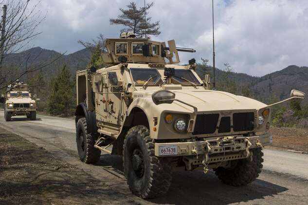 A Mine Resistant Ambush Protected All-Terrain Vehicle, better known as MATV, drives into the motor pool at the Japan Ground Self-Defense Force’s Haramura training grounds during Exercise Haramura 1-15 in Hiroshima, Japan, April 14, 2015. Haramura is a weeklong company-level training exercise focused on honing the skills Marines learned during Marine Combat Training and their Military Occupational Specialty schooling.