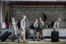 8th Fighter Wing Airmen load luggage into a truck after receiving a deployment briefing at Kunsan Air Base, Republic of Korea, April 10, 2015. Approximately 170 Wolf Pack personnel departed for Gwangju Air Base,ROK, to participate in Exercise Max Thunder 15-1, the largest flying exercise held on the Korean Peninsula. (U.S. Air Force photo by Senior Airman Taylor Curry/Released) 