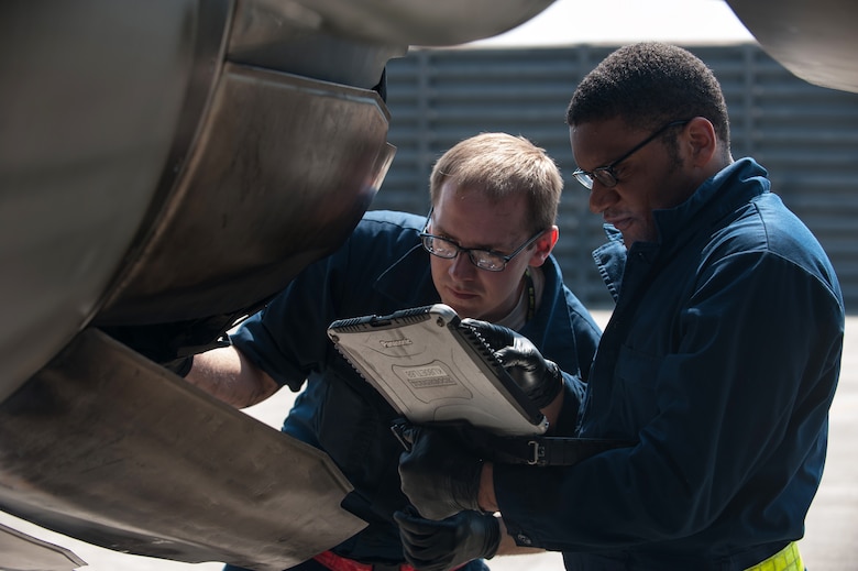 Staff sergeants Christopher Conley and Bobby Reed, 8th Aircraft Maintenance Squadron jet engine mechanics, work on an F-16 Fighting Falcon during Exercise Max Thunder 15-1 at Gwangju Air Base, Republic of Korea, April 21, 2015. Max Thunder is a regularly scheduled training exercise designed to enhance the readiness of U.S. and ROK air forces to defend the ROK. (U.S. Air Force photo by Senior Airman Taylor Curry/Released) 