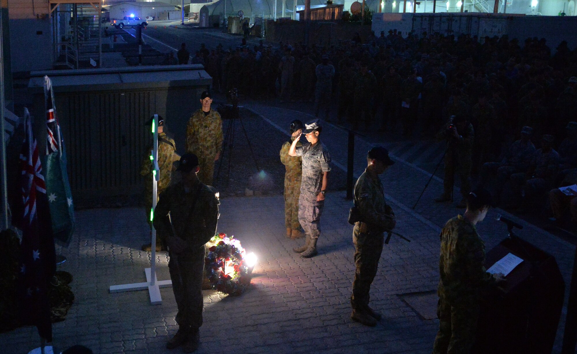 Brig. Gen. John, wing commander, renders a salute during the Australian and New Zealand Army Corps Day at an undisclosed location in Southwest Asia April 25, 2015. The annual memorial marks the anniversary of the first major military action fought by Australian and New Zealand forces during the First World War. (U.S. Air Force photo/Tech. Sgt. Jeff Andrejcik)