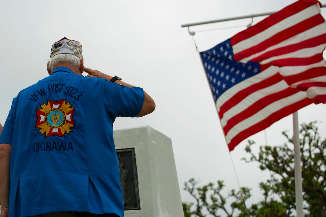 Dennis E. Provencher, the district commander of Veterans of Foreign Wars Post 9723, Okinawa salutes the Ernie Pyle Monument April 19, after placing a floral wreath at the foot of the epitaph on Ieshima, Okinawa, Japan. Okinawa citizens, service members, veterans, Boy Scouts, and families gather to honor the 70th anniversary of Ernest T. “Ernie” Pyle’s death at the sight where he was killed in 1945 during the battle of Okinawa. Pyle was a Pulitzer Prize winner and served as a war correspondent from 1935 through most of World War II, famous for his columns for the Scripps-Howard newspaper chain. Pyle volunteered to deploy with the men of the Army’s 77th Infantry Division to report first-hand during the battle of Okinawa.