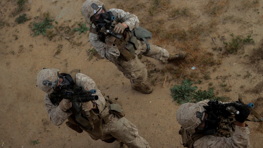 Marines with 1st Battalion, 7th Marine Regiment provide security in a simulated combat town during the culminating event of Division School’s Urban Leaders Course aboard Marine Corps Base Camp Pendleton, California, April 22, 2015. The three-week course is designed to prepare Marines to lead in an urban environment.
