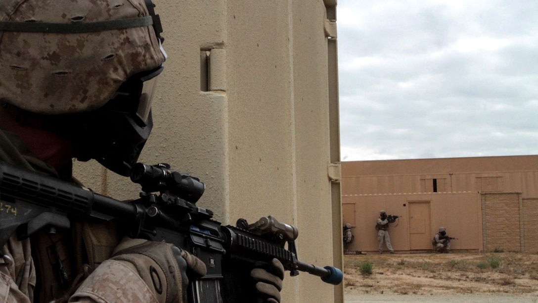 Marines with 1st Battalion, 7th Marine Regiment provide security in a simulated combat town during the culminating event of Division School’s Urban Leaders Course aboard Marine Corps Base Camp Pendleton, California, April 22, 2015. The three-week course is designed to prepare Marines to lead in an urban environment.