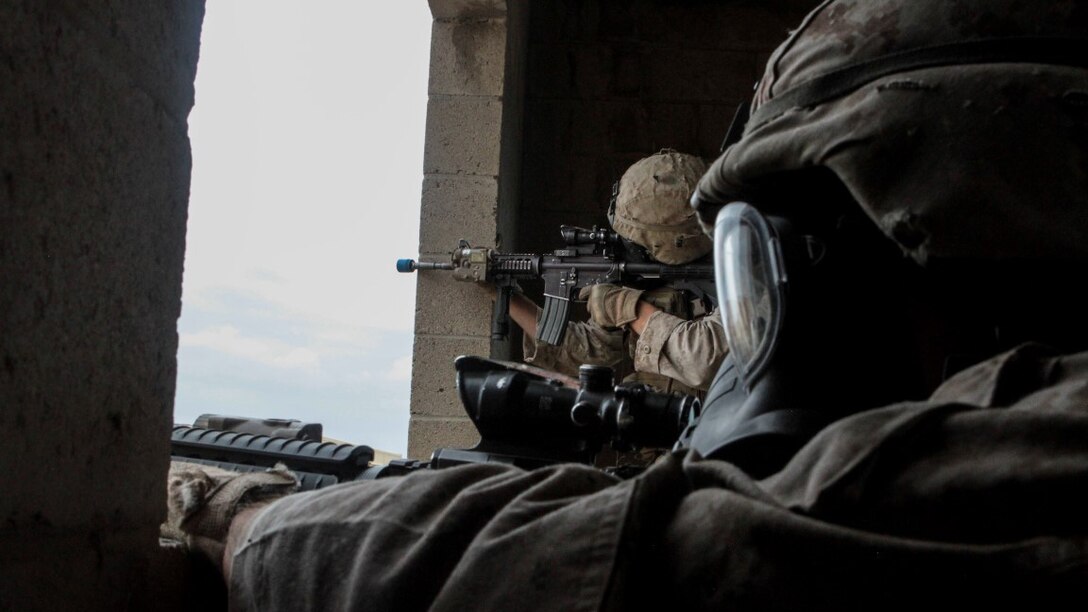 Marines with 1st Battalion, 7th Marine Regiment provide security in a simulated combat town during the culminating event of Division School’s Urban Leaders Course aboard Marine Corps Base Camp Pendleton, California, April 22, 2015. The three-week course is designed to prepare Marines to lead in an urban environment.
