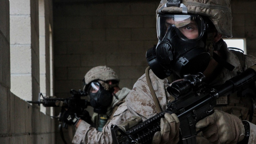 Marines with 1st Battalion, 7th Marine Regiment provide security in a simulated combat town during the culminating event of Division School’s Urban Leaders Course aboard Marine Corps Base Camp Pendleton, California, April 22, 2015. The three-week course is designed to prepare Marines to lead in an urban environment.