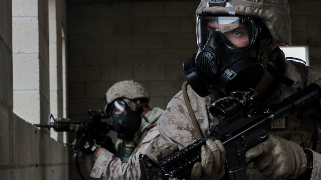 Marines with 1st Battalion, 7th Marine Regiment provide security in a simulated combat town during the culminating event of Division School’s Urban Leaders Course at Marine Corps Base Camp Pendleton, Calif., April 22, 2015. The three-week course is designed to prepare Marines to lead in an urban environment.