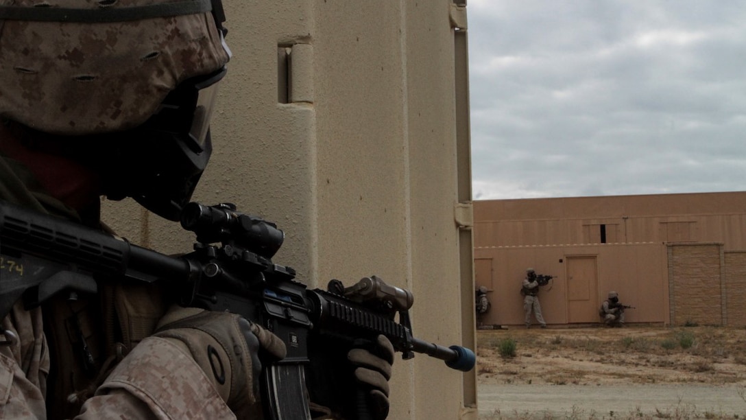 Marines with 1st Battalion, 7th Marine Regiment provide security in a simulated combat town during the culminating event of Division School’s Urban Leaders Course at Marine Corps Base Camp Pendleton, California, April 22, 2015. The three-week course is designed to prepare Marines to lead in an urban environment.