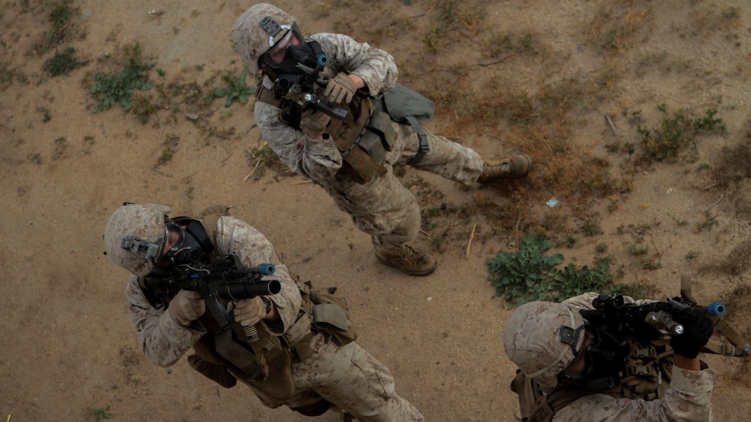 Marines with 1st Battalion, 7th Marine Regiment provide security in a simulated combat town during the culminating event of Division School’s Urban Leaders Course at Marine Corps Base Camp Pendleton, California, April 22, 2015. The three-week course is designed to prepare Marines to lead in an urban environment.