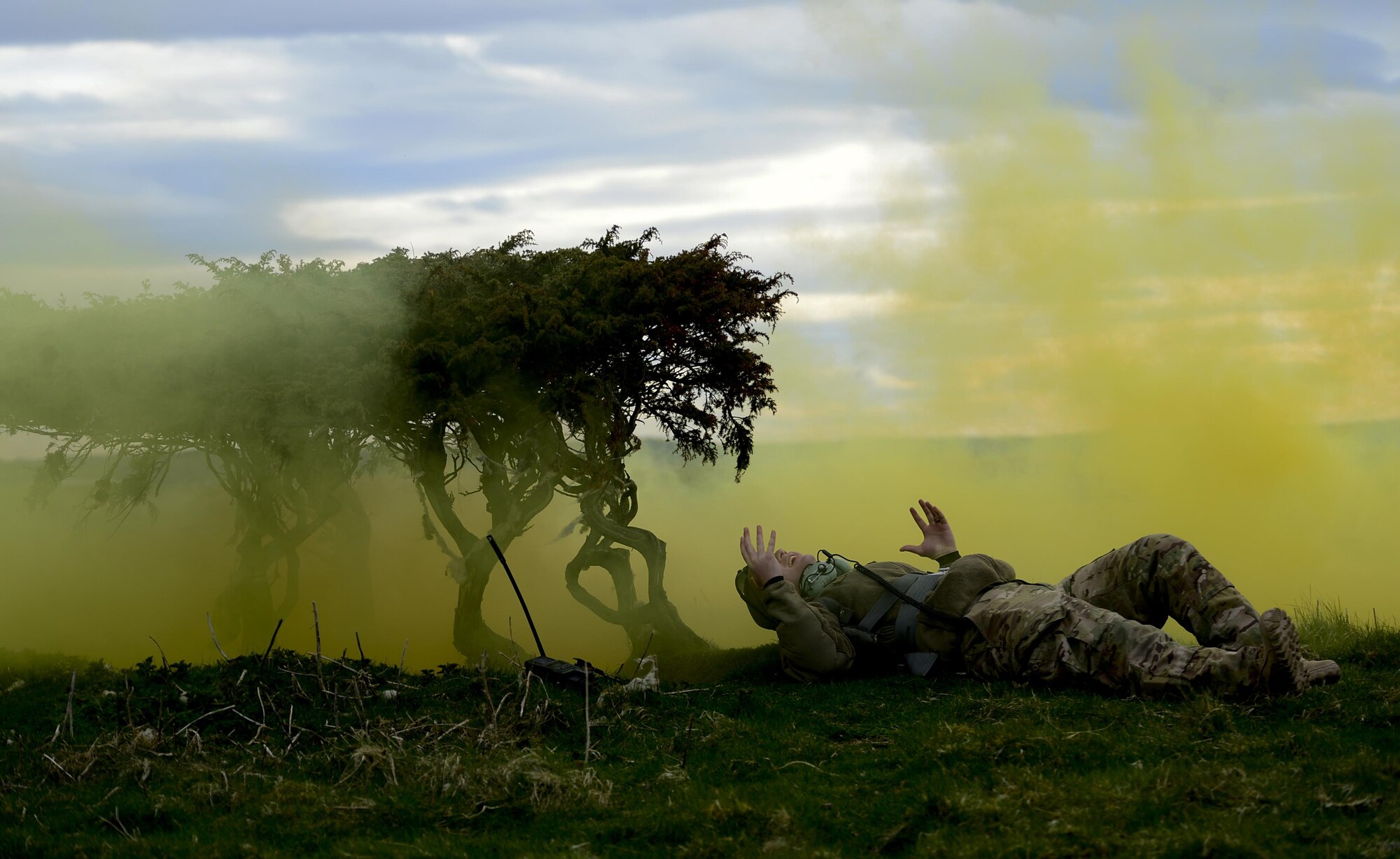 Staff Sgt. Rob Blume, a 56th Rescue Squadron HH-60G Pave Hawk intelligence analyst, pretends to be a survivor during a 56th RQS training mission at exercise Joint Warrior 15-1 in Scotland, April 21, 2015. The exercise enhanced the 56th RQS's capability to support future, real-world operations. (U.S . Air Force photo/Senior Airman Erin O'Shea)