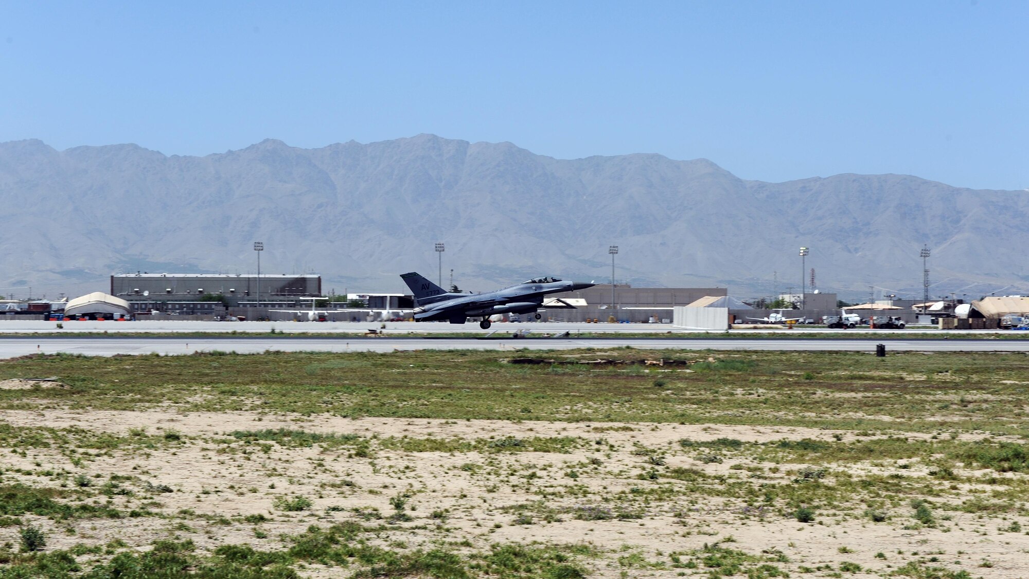 An F-16 Fighting Falcon “Triple Nickel” aircraft assigned to the 555th Fighter Squadron from Aviano Air Base, Italy, prepares to land on the flightline at Bagram Airfield, Afghanistan, April 27, 2015. Members of the Triple Nickel are deployed in support of Operations Freedom’s Sentinel and Resolute Support and are in theater to replace the 4th Fighter Squadron from Hill Air Force Base, Utah. (U.S. Air Force photo by Staff Sgt. Whitney Amstutz/released)