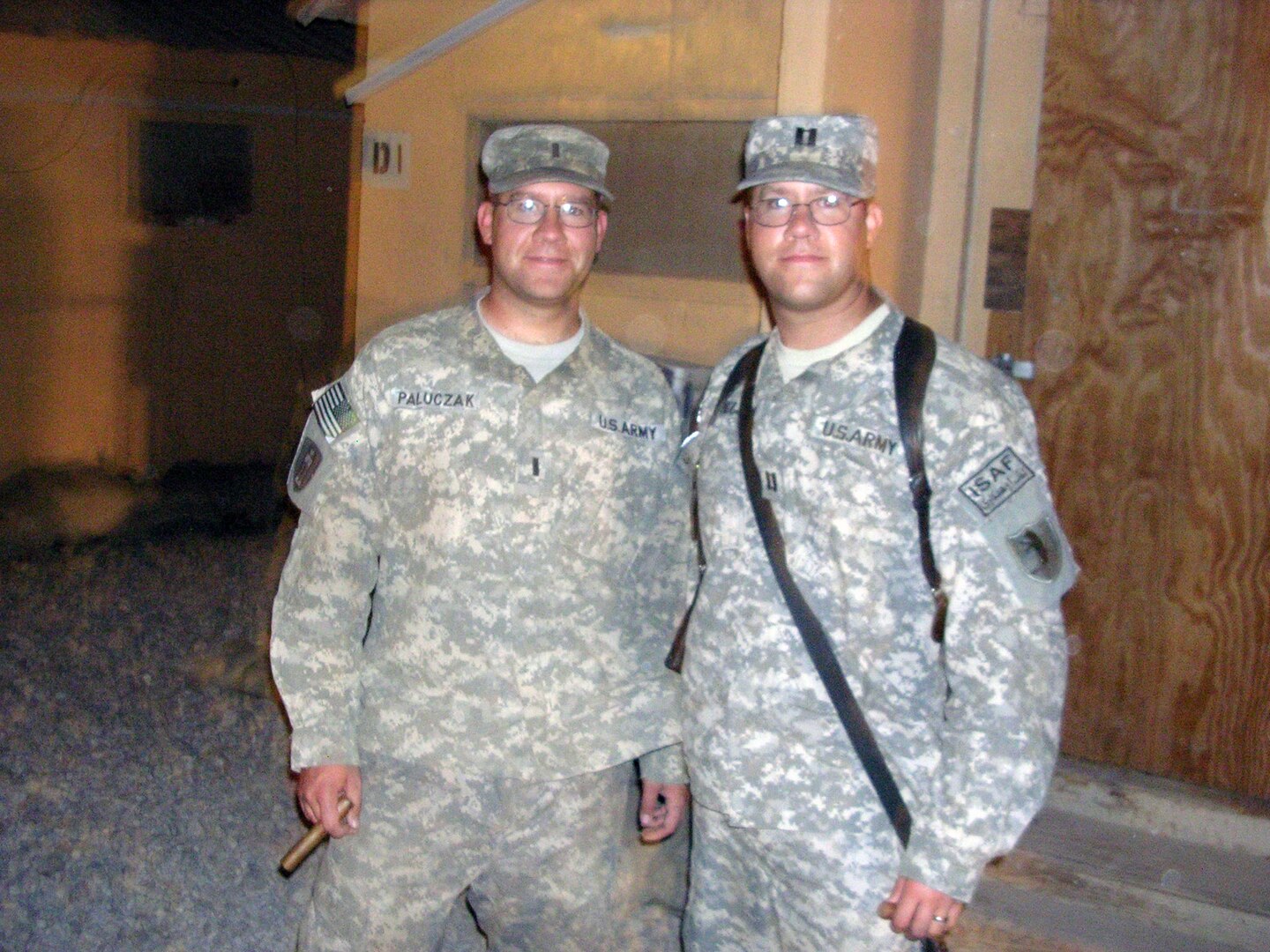 Army 1st Lt. Michael Paluczak and his twin brother, Army Capt. John Paluczak, enjoy a reunion on Bagram Airfield in eastern Afghanistan's Kabul province, Sept. 7, 2010.