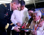 Oregon Army National Guard Brig. Gen. Steven R. Beach (right), Assistant Adjutant General for Support, and retired Lt. Gen. Ernesto G. Carolin, center, administrator, Philippines Veterans Affairs Office, present medals to Filipino WWII guerrilla fighters at the Provincial Capital on April 22, 2015. The awards are part of several events celebrating the 70-year anniversary of the end of WWII and the liberation of the island of Palawan, Philippines. The events, "A Salute to Valor: Palawan-70 years of freedom," honored the partnership of the Filipino guerrillas and the Oregon National Guard's 41st Infantry Division during WWII and their participation in the liberation in 1945. 