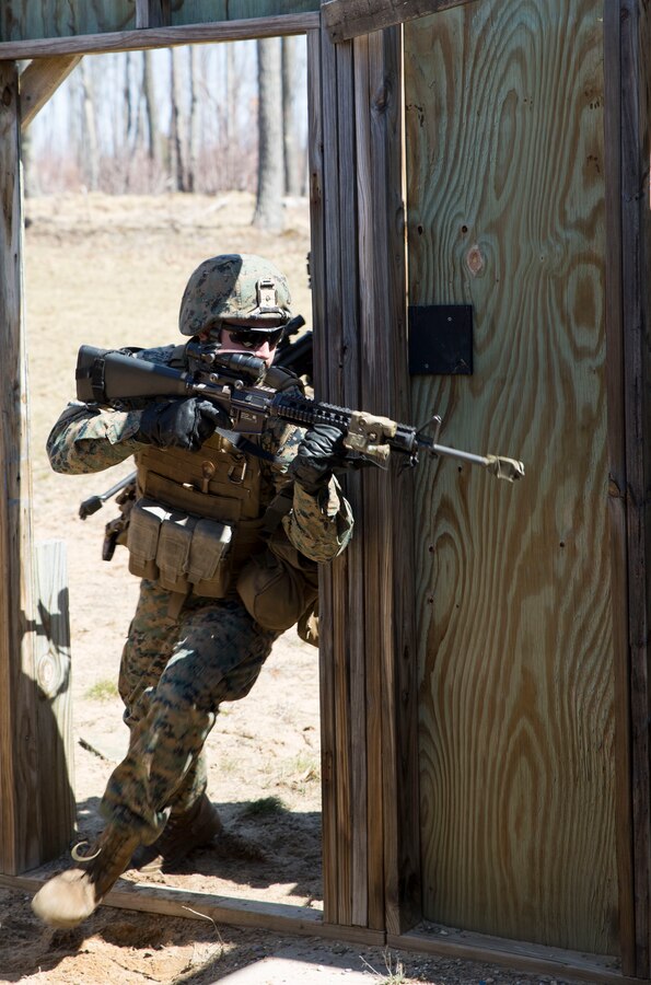 Lance Cpl. Tyler G. Ruffer, a rifleman with Charlie Company, 1st Battalion, 24th Marine Regiment, 4th Marine Division, Marine Forces Reserve, leads a room clearing drill during Exercise Arctic Eagle at Camp Grayling, Mich., April 24, 2015. The Marines practiced tactics such as room clearing, door breaching and urban patrolling as a work up to an urban warfare simulation at Camp Grayling's Combined Armed Collective Training Facility the following day. (U.S. Marine Corps photo by Cpl. Ian Leones/Released)