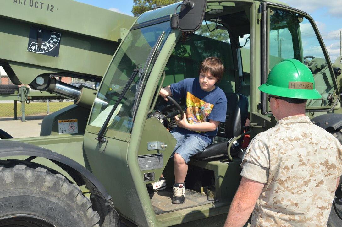 On 23 April 2015 the Marines of 8th Communication Battalion conducted a family friendly "Bring your child to work day" event. The families enjoyed seeing some of the tools and equipment utilized by their Marines as well as getting a little hands on with some heavy equipment and some weapons systems. All in all it was a great time for the families and their Marines.