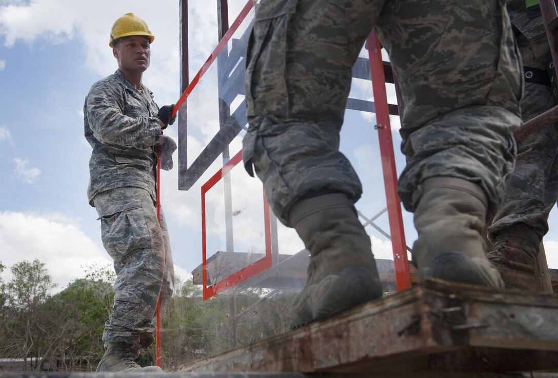 U.S. Air Force Staff Sgt. Corey Gates, 673rd Civil Engineer Group, a heating, ventilation, air conditioning craftsman, helps raise a backboard during construction a multipurpose basketball court during exercise Balikatan 2015, in San Rafael on the island of Palawan, Philippines, April 25. The construction of the basketball court was a part of an discretionary project that included excess materials and donations. This year marks the 31st iteration of the exercise, which is an annual Philippine-U.S. bilateral military training exercise and humanitarian civic assistance engagement.