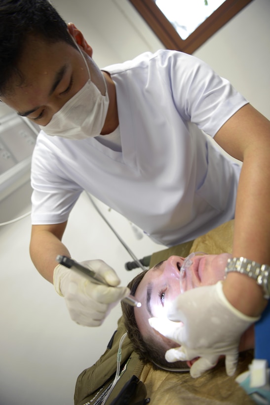Dante Pineda, an emergency room nurse from Medical City Clark, Philippines, examines a simulated patient’s eyes during a medical evacuation scenario as part of Exercise Balikatan 2015, April 18, 2015. Balikatan, an annual Philippines-U.S. military bilateral training exercise and humanitarian assistance engagement, is a signature element of the Philippines-U.S. alliance. This year’s exercise focuses on scenario-based combined action planning in territorial defense, disaster relief, civic assistance and tactical level field training.