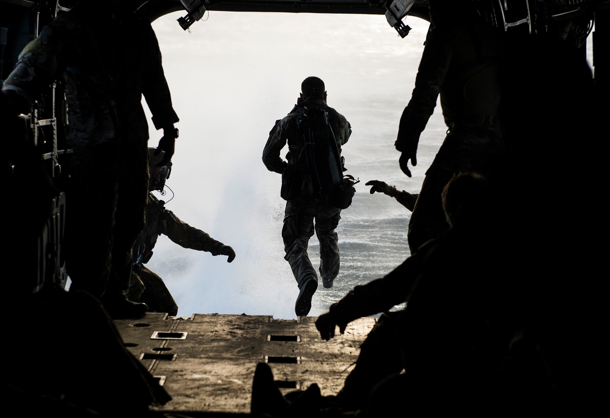 A member of the Chilean navy jumps from a CH-47 Chinook as part of Emerald Warrior at Hurlburt Field, Fla., April 21, 2015. Emerald Warrior is the Department of Defense's only irregular warfare exercise, allowing joint and combined partners to train together and prepare for real-world contingency operations. (U.S. Air Force photo by Staff Sgt. Kenneth W. Norman/Released)