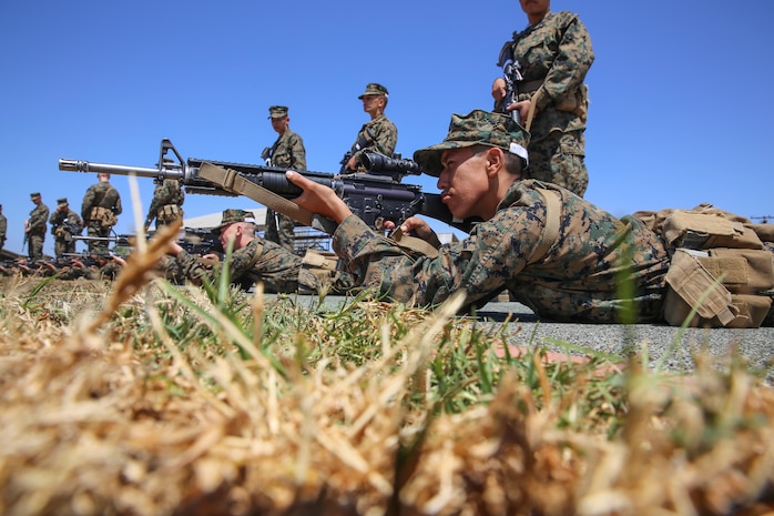 Recruit Jesus Garcia, Charlie Company, 1st Recruit Training Battalion, practices his prone position while snapping in during Grass Week at Edson Range, Marine Corps Base Camp Pendleton, Calif., April 14. Recruits sight in on white drums with targets painted on them, simulating the actual targets that recruits will see at various firing lines. During this time, instructors will correct recruits on their positions and give them tips on how they can be more comfortable. The depot is responsible for training more than 16,000 recruits annually. Charlie Company is scheduled to graduate June 5. Garcia is a native of Fresno, Calif., and was recruited out of Recruiting Station San Francisco.