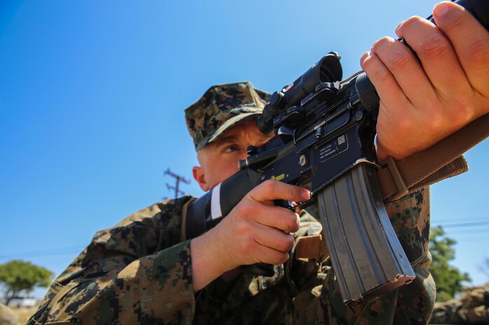 Recruit Brett C. Waters, Charlie Company, 1st Recruit Training Battalion, practices his prone position while snapping in during Grass Week at Edson Range, Marine Corps Base Camp Pendleton, Calif., April 14. Snapping in allows recruits to build muscle memory in each of the four shooting positions, and begin to apply what they’ve learned.  Recruits sight in on white drums with targets painted on them simulate the actual targets that they will see at various firing lines. The following week, the recruits of Charlie Company will head down range and make use of what they learned and qualify for their marksmanship badges. Today, all male recruits recruited from recruiting stations west of the Mississippi are trained at MCRD San Diego. The depot is responsible for training more than 16,000 recruits annually. Charlie Company is scheduled to graduate June 5. Waters is a native of Thornton, Colo., and was recruited of Recruiting Station Denver.