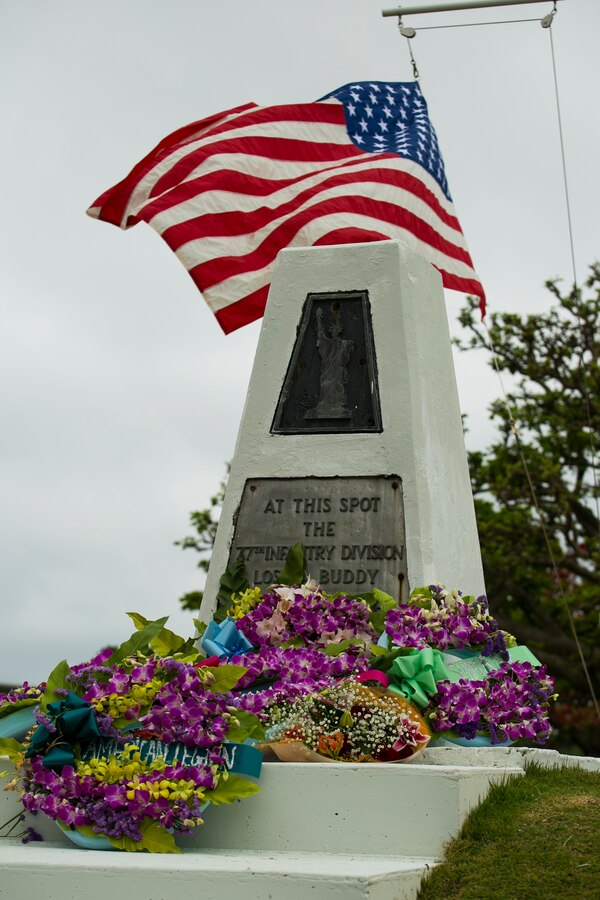 Flowers lie at the foot of the Ernie Pyle Monument after being placed during a memorial ceremony April 19, on Iejima, Okinawa, Japan. Okinawa citizens, service members, veterans, Boy Scouts, and families gathered to honor the 70th anniversary of American war correspondent Ernest T. “Ernie”Pyle’s death at the sight where he was killed in 1945 during the battle of Okinawa. Pyle was a Pulitzer Prize winner and served as a war correspondent from 1935 through most of World War II, famous for his columns in the Scripps-Howard newspaper chain. Pyle volunteered to deploy with the men of the Army’s 77th Infantry Division to report first-hand during the battle of Okinawa. 
