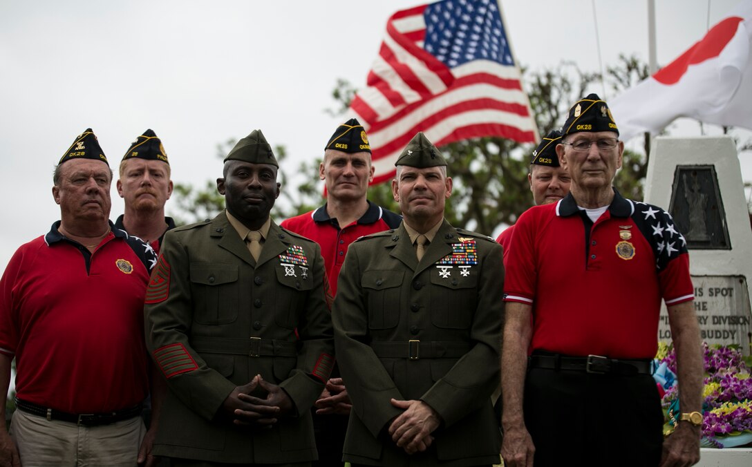 Marines with Headquarters & Support Battalion, Marine Corps Installations Pacific-Marine Corps Base Camp Butler, Japan and veterans with the American Legion Post 28, Okinawa, pose in front of the Ernie Pyle Monument after placing floral wreaths on the epitaph April 19, on Iejima, Okinawa, Japan. Okinawa citizens, service members, veterans, Boy Scouts, and families gathered to honor of the 70th anniversary of American war correspondent Ernest T. “Ernie” Pyle’s death at the sight where he was killed in 1945 during the battle of Okinawa. Pyle was a Pulitzer Prize winner and served as a correspondent from 1935 through most of World War II, famous for his columns in the Scripps-Howard newspaper chain. Pyle volunteered to deploy with the men of the Army’s 77th Infantry Division to report first-hand during the battle of Okinawa.