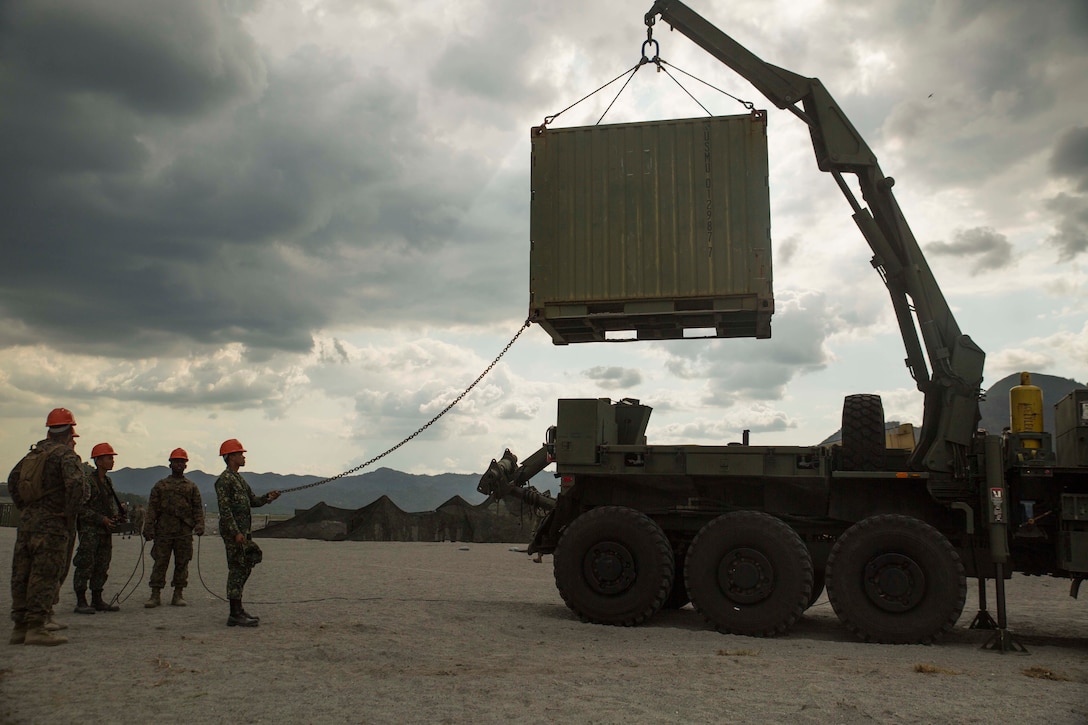 Philippine and U.S. Marines move a 20-ton container with a MKR-15 Wrecker April 23 at Crow Valley, Philippines, during Exercise Balikatan 2015. Philippine Marines gave an opportunity to their U.S. counterparts to learn the capabilities of the AMK-36 and the MKR-15 wrecker logistical vehicles. The vehicles provide movement of heavy storage containers and equipment, which increases the effectiveness of the logistical combat element. Balikatan is an annual exercise that enhances military-to-military relationships with the Armed Forces of the Philippines. The U.S. Marines are assigned to Combat Logistics Battalion 4, Combat Logistics Regiment 3, 3rd Marine Logistics Group, III Marine Expeditionary Force. The Philippine Marines are assigned to Motor Transportation and Maintenance Battalion, Service Support Brigade.